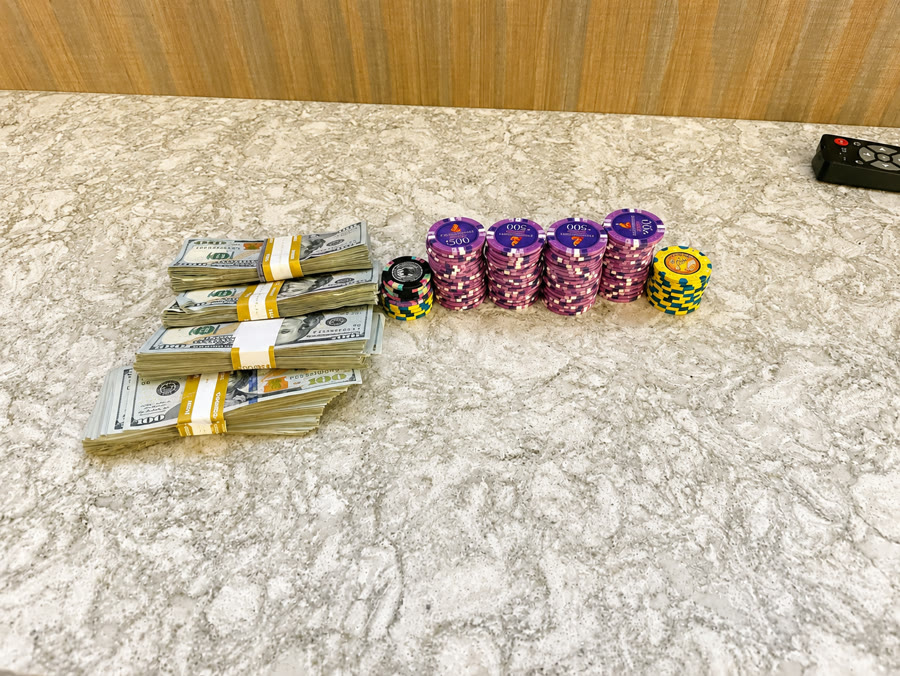 Cash and chips on the counter after a session