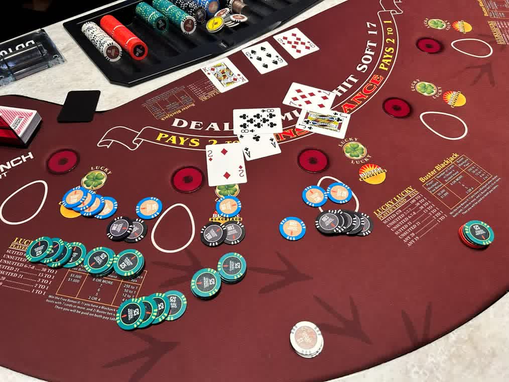 Live blackjack table covered in chips mid-session