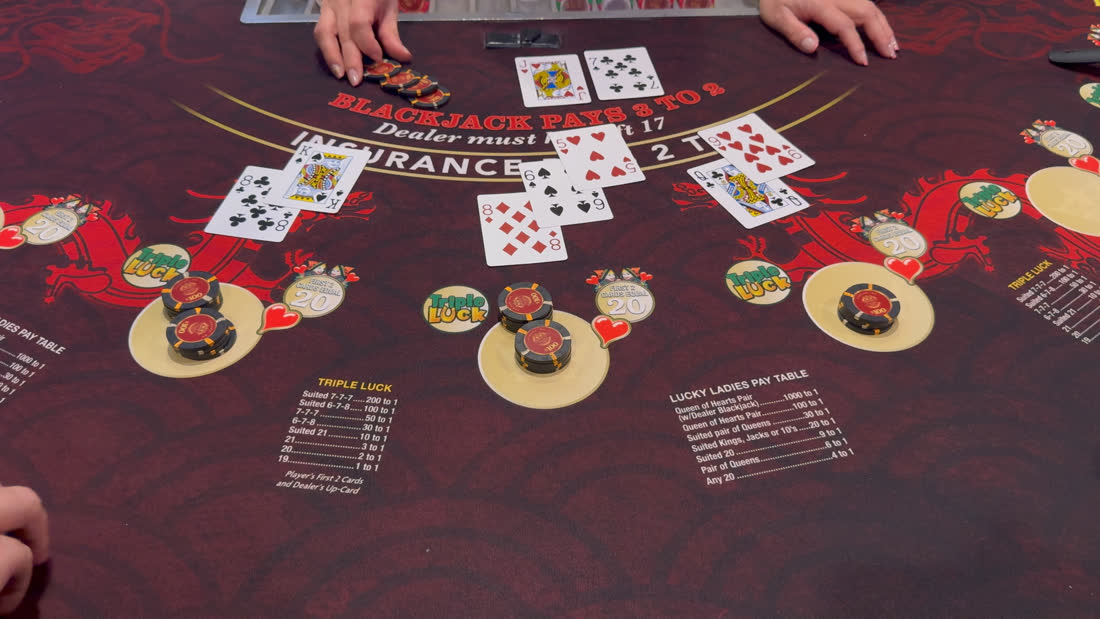 Live blackjack table from the filmed run — $100 chips in play across three spots