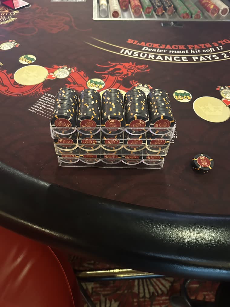Rack of $100 chips on the felt